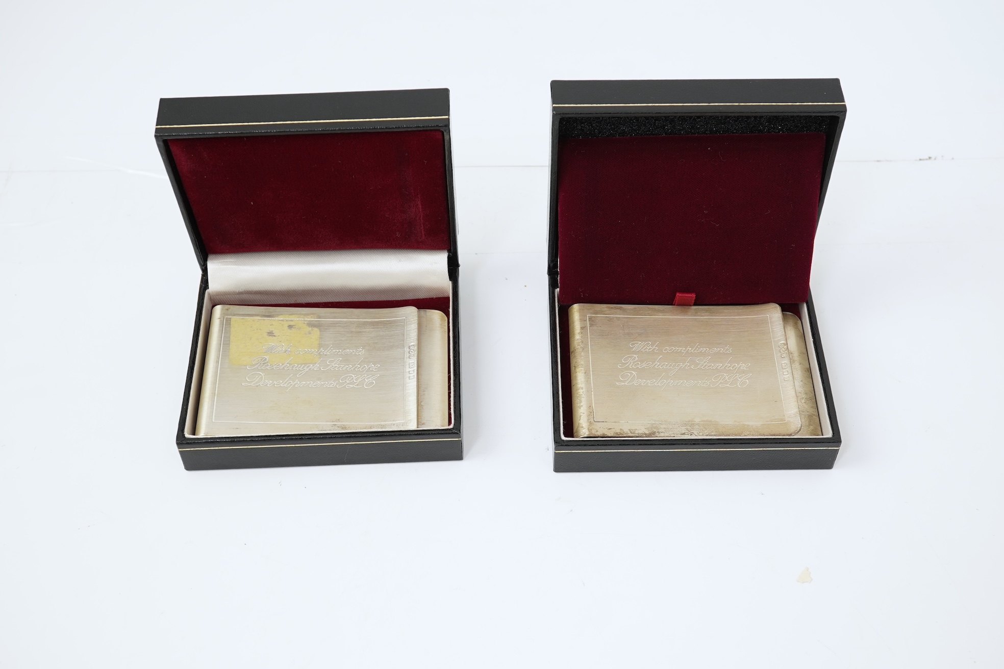A pair of Elizabeth II silver money clips by Adrian Gerald Benney